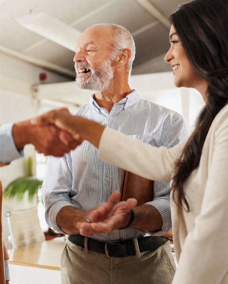 Noilan Segal, founder of Segvia Insurance Group, greeting a client after helping them find the right Medicare plan